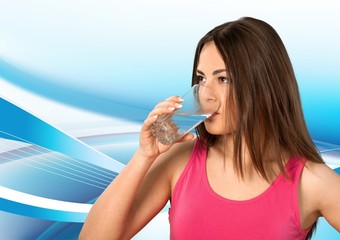 Happy young woman drinking milk