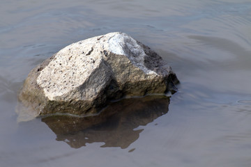 Rock in water shallow, Big stone in the drought, Stone over Surface water Global warming concept