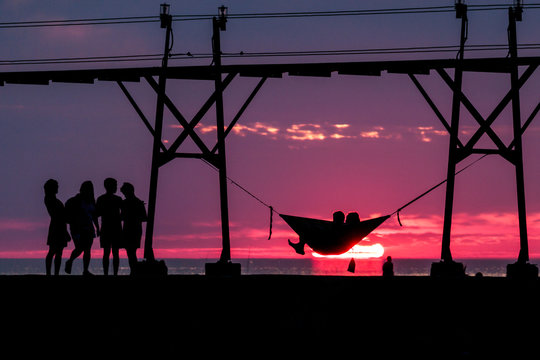 Sunset with friends in a hammock