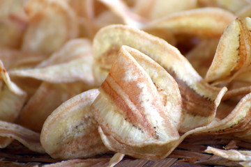 Banana fried pieces slice thin, Banana fried snack, Banana fried pieces close up (selective focus)
