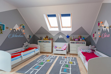 Modern bedroom for boy and girl with furnitures and toys