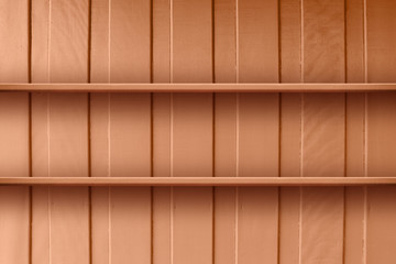 wooden wall home with shelves empty oil paint orange brown color, wood brown shelf in front of wooden wall and view with copy space, plank shelf blank at wall wood pastel brown for template display