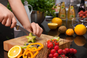 woman cutting vegetables in the kitchen