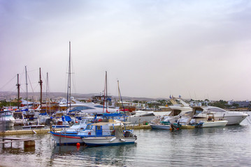 Fototapeta na wymiar Fishing boats and yachts at the pier.