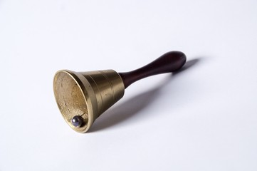Obraz na płótnie Canvas old hand bell made of brass with a wooden handle
