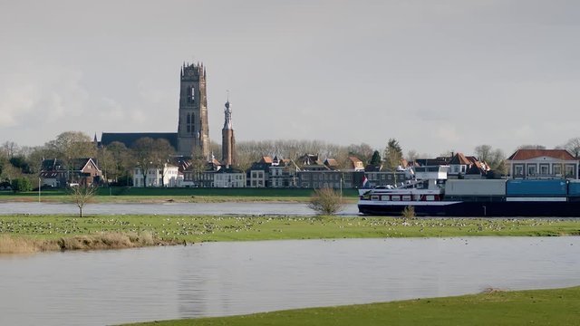 Zaltbommel with river Waal and container ship