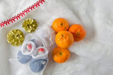 tangerines, cones, ribbon and christmas present