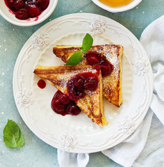 French toast with cherry sauce.