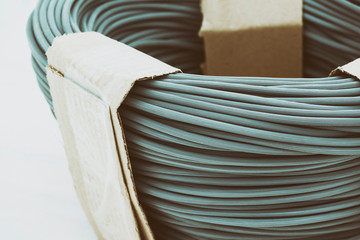 rubber seal. designed for use in windows and mosquito nets and other products. wooden white background. there is toning