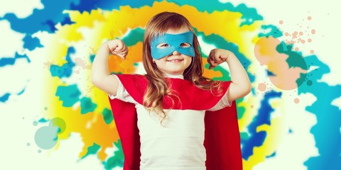 Obraz na płótnie Canvas Portrait of beautiful little girl in superhero costume on sky