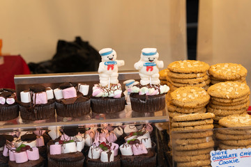 Festive chocolate Cupcakes and chocolate chip Cookies at a Christmas Market.