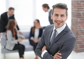 Young man in business suit smiling