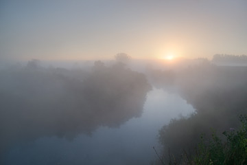 Morning landscape. Sunrise and very thick fog, Misty river. foggy morning
