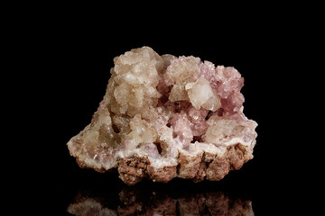 Macro mineral stone Pink Amethyst on a black background