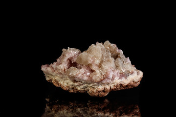 Macro mineral stone Pink Amethyst on a black background