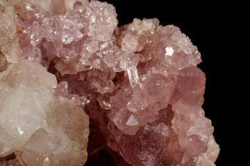 Macro mineral stone Pink Amethyst on a black background