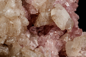 Macro mineral stone Pink Amethyst on a black background