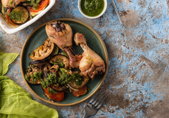 Ratatouille with chicken and pesto. French cuisine. Rosemary chicken with oven-roasted ratatouille.