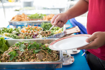 Food Buffet Catering Dining Eating Party Sharing Concept.people group catering buffet food indoor in luxury restaurant with meat colorful fruits and vegetables