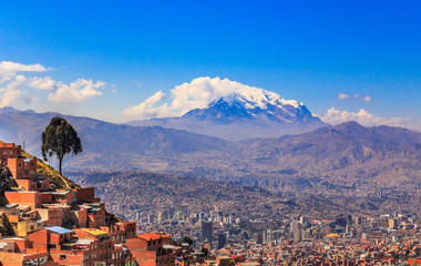 view to the snow cap of Illimani peak and valley full of living - obrazy, fototapety, plakaty