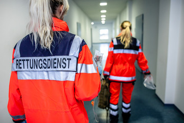 German paramedic runs in a floor to an accident