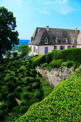 Fototapeta na wymiar The topiary art of the magnifcent gardens of the Chateau de Marqueyssac near Vezac in the Dordogne region of France