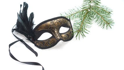 Image of elegant black and gold venetian, mardi gras mask on white snow background. Vintage photo. Christmas New Year carnaval Party night conception. Venice Carnival mask, close up