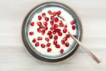 Bowl with yogurt and pomegranate.
