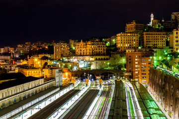 Fototapeta na wymiar Night views over the italian city Genova and railwayroads, Liguria, Italy