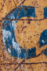 blue letter on rusty metal, blue stencil painted on rusty background, letter c
