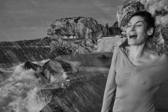 Water falling on excited female