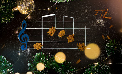 Pentagrama  musical con notas y luces de navidad