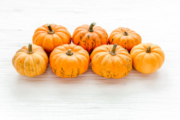 Orange pumpkins Halloween isolated on white background. Flat lay, top view. Autumn minimal concept.