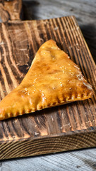 Traditional Georgian bread - khachapuri and Kolkh khachapuri on the wooden background.