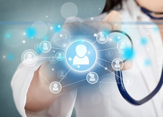 Medical icons and young  doctor with stethoscope