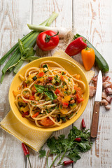 spaghetti with vegetables and bacon