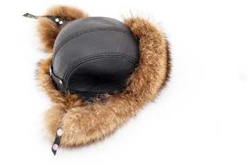Fur hat for winter for men, on natural snow. there is toning and close-up