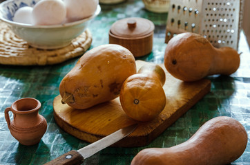 Light brown zucchini on a cutting board on the kitchen table