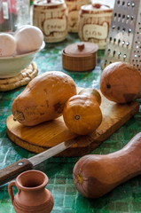 Light brown zucchini on a cutting board on the kitchen table