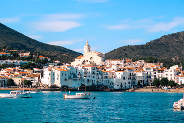 Cadaque's village in Spain, bright water with white houses.