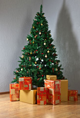 Christmas tree with gifts in colourful boxes