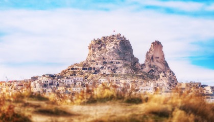 Fototapeta na wymiar Uchisar Fortress City, Turkey. Goreme National Park and the Rock Sites of Cappadocia, a UNESCO World Heritage site.