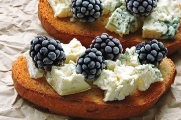 Healthy toasts with blue cheese and blackberries. Keto diet. Keto snack.