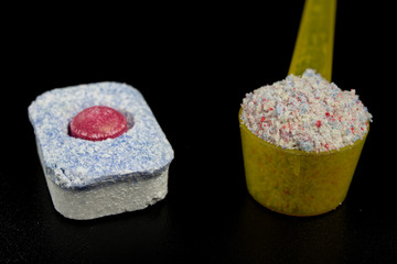 Powder and tablets for the dishwasher on the kitchen table. Cleaning agent for household...
