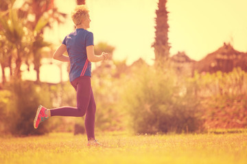 young female runner training for marathon