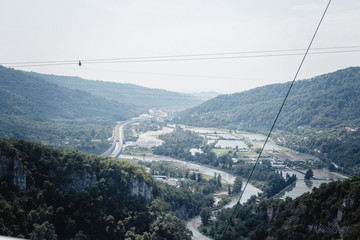 Panoramic view of the mountains and the river in Sochi from skybridge. trout factory