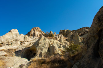Rock formations in Goreme Open Air Museum. Most popular and famous place in Cappadocia, Turkey. Sunny day, clear blue sky 