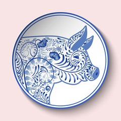 Decorative plate with blue patterned head of a pig. Symbol of new year 2019 isolated on pink background.