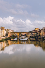 View of Ponte Vecchio in Florence (Firenze) in a cloudy day. Beautiful landscape of Florencia, Italy.