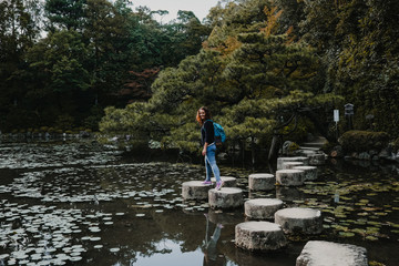 Fototapeta na wymiar .Young occidental woman discovering the nipon country. Tourism in the temples and gardens of Kyoto in Japan. Travel photography